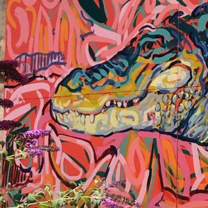 An art installation featuring representations of southern dinosaurs, exploring prehistoric life in the region