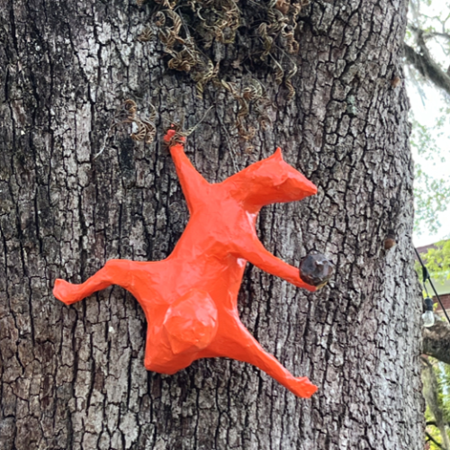 Orange Squirrel An outdoor art installation featuring sculptures and artworks depicting various wildlife, emphasizing the beauty and diversity of nature.