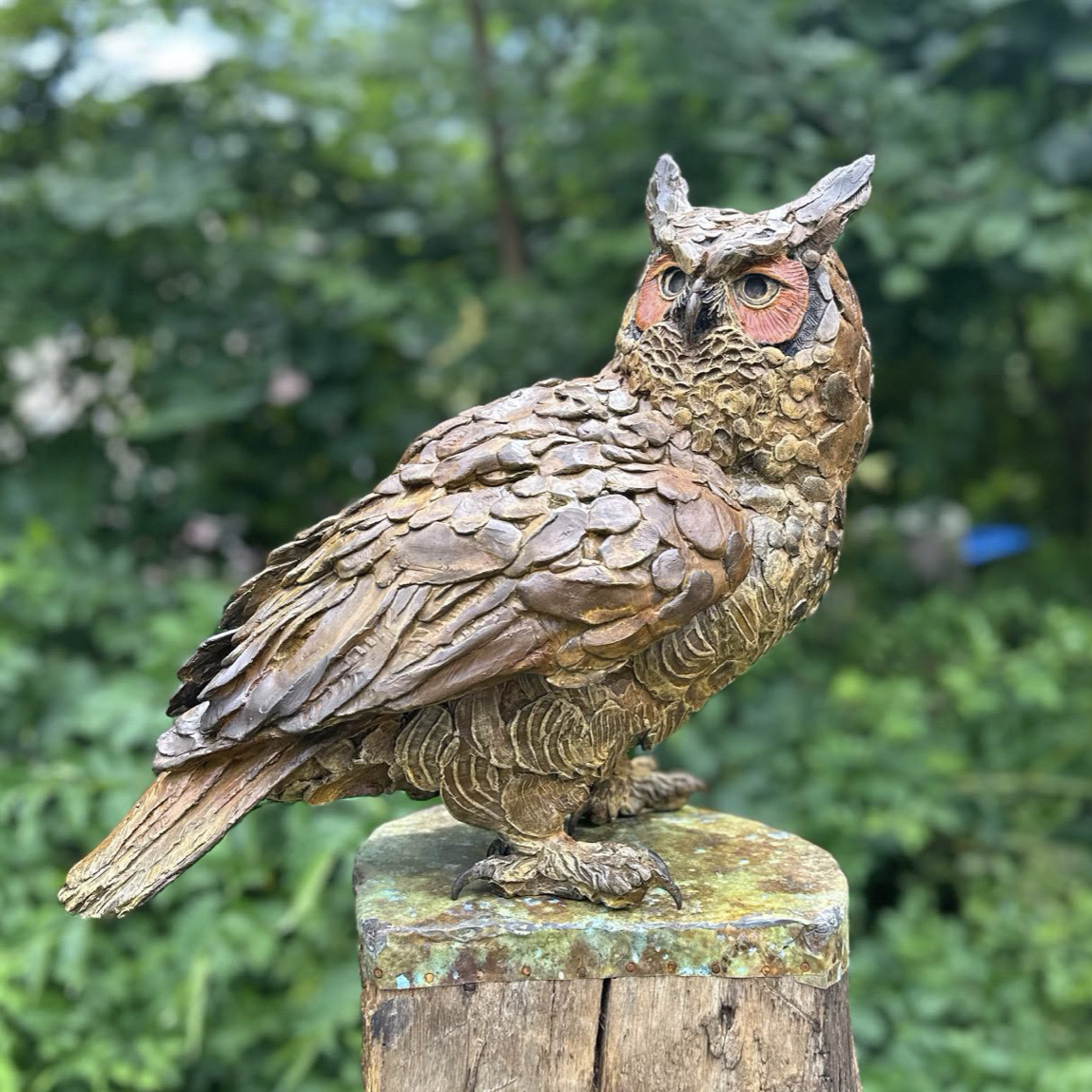 Bronze sculpture titled 'Pinetop Protector' by artist Paul Rhymer, depicting an owl perched atop a pine branch, honoring Diane Williams Parker for her conservation efforts in the Red Hills region