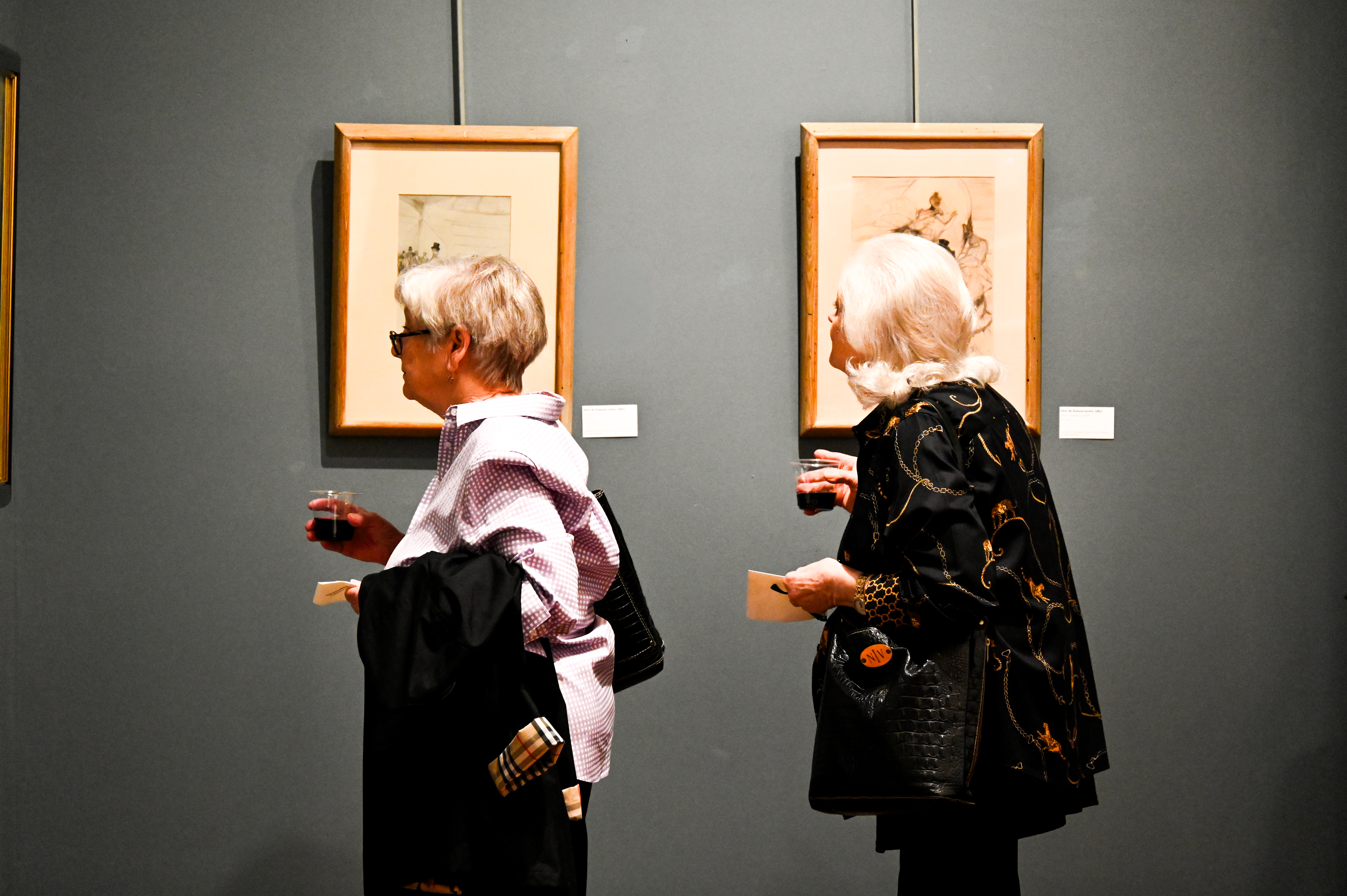 Adults enjoying an evening of art exploration and socializing during the Art Night Out! event, featuring open gallery spaces and creative activities.