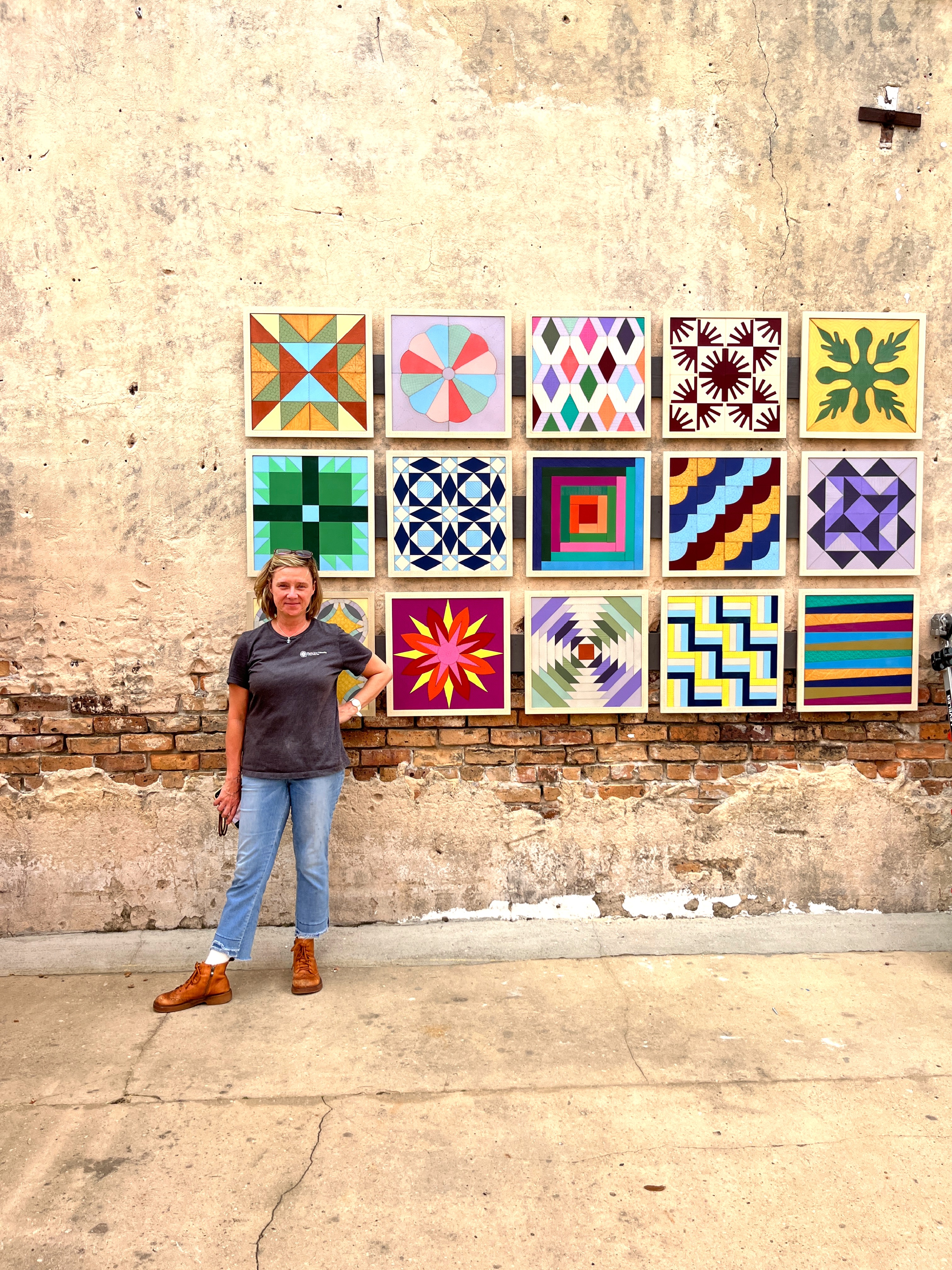 Colorful yarn installations adorning public spaces in the Creative District, adding a whimsical touch to the urban landscape.